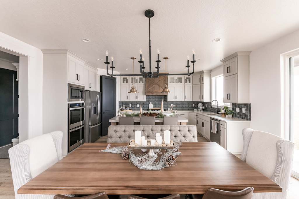 Dining area with light hardwood / wood-style flooring and sink