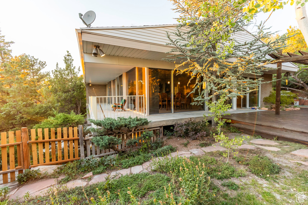 Back of house featuring a deck