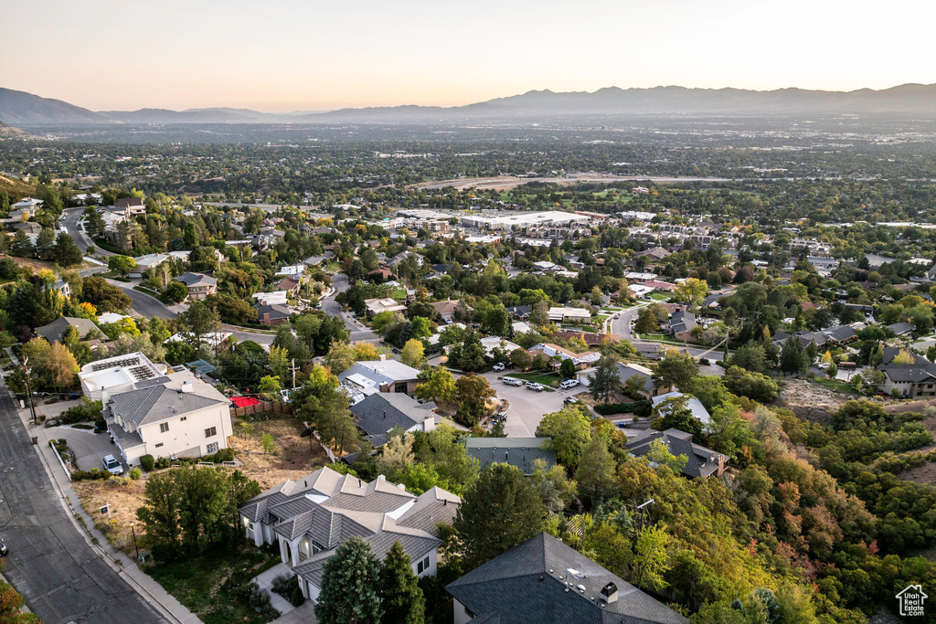 Aerial view at dusk featuring a mountain view