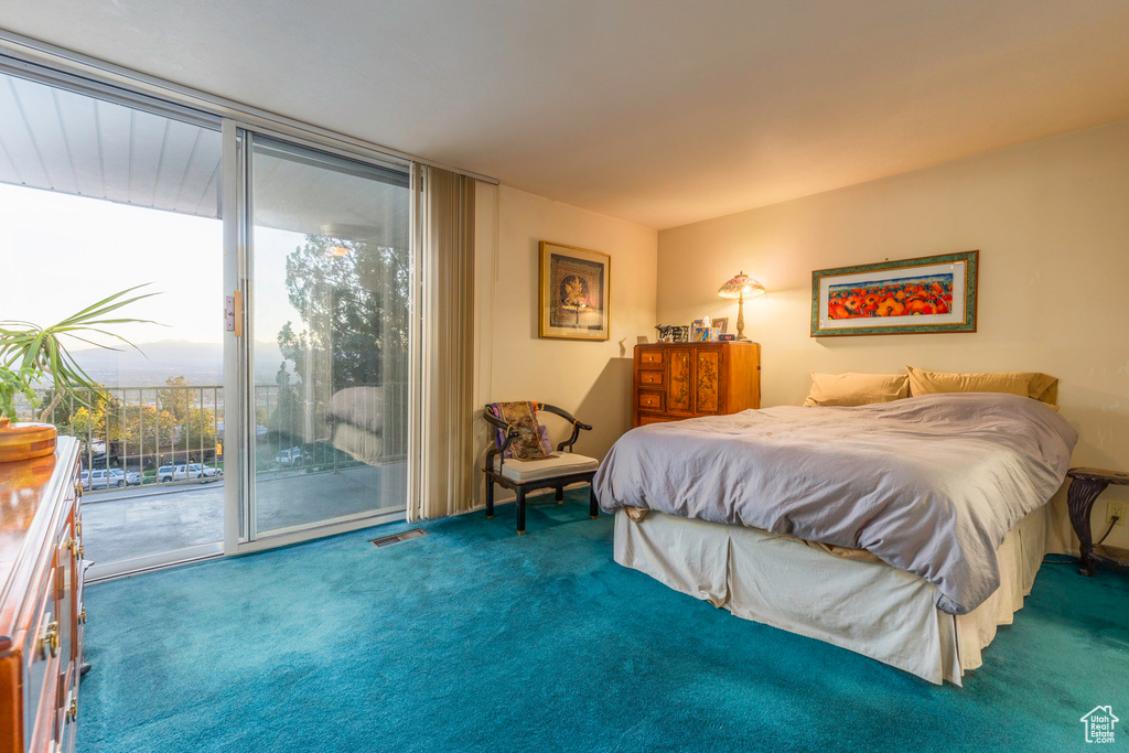 Bedroom with carpet floors and access to exterior