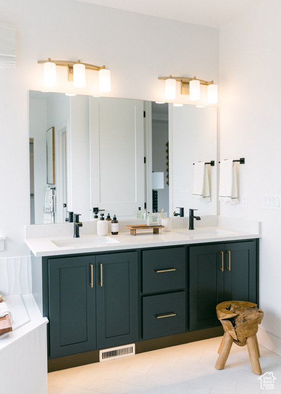 Bathroom featuring vanity and a bathtub