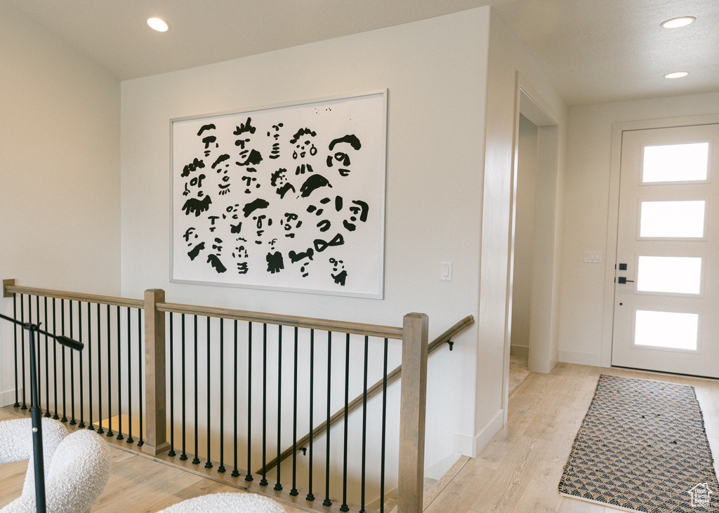 Entrance foyer featuring light hardwood / wood-style flooring