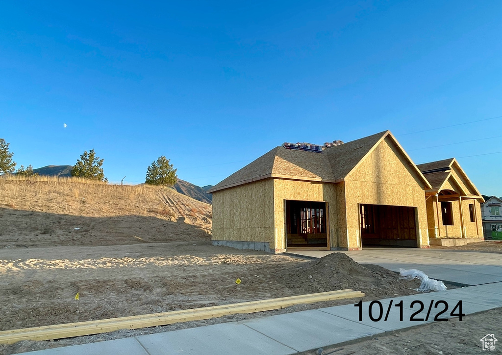 View of front of property featuring a garage