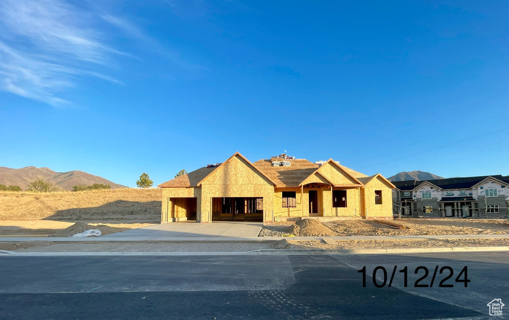 Unfinished property featuring a mountain view