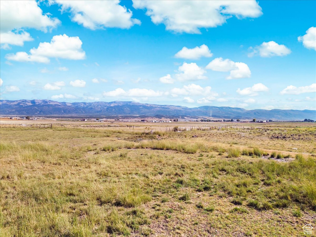 Property view of mountains with a rural view