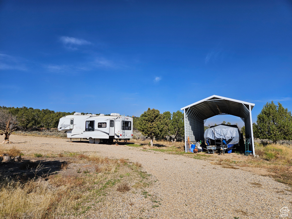 Exterior space featuring a carport