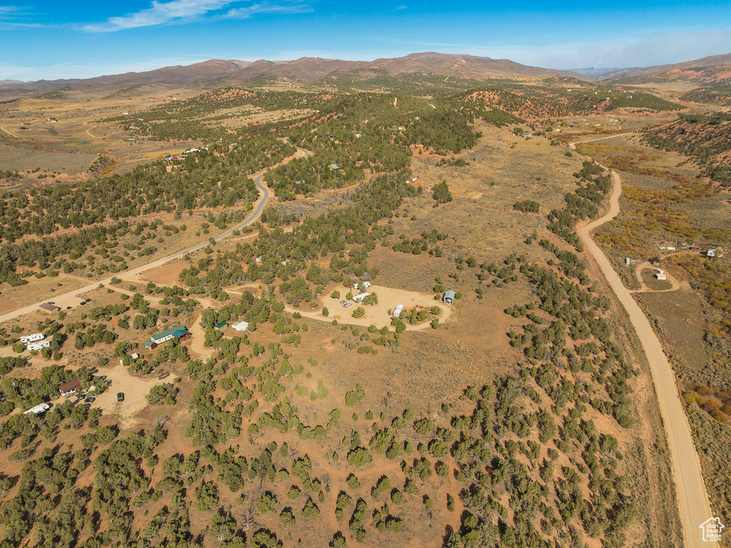 Birds eye view of property with a mountain view