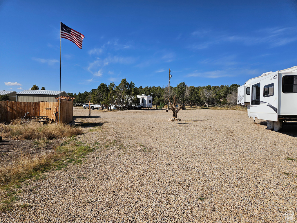 View of yard with a storage shed