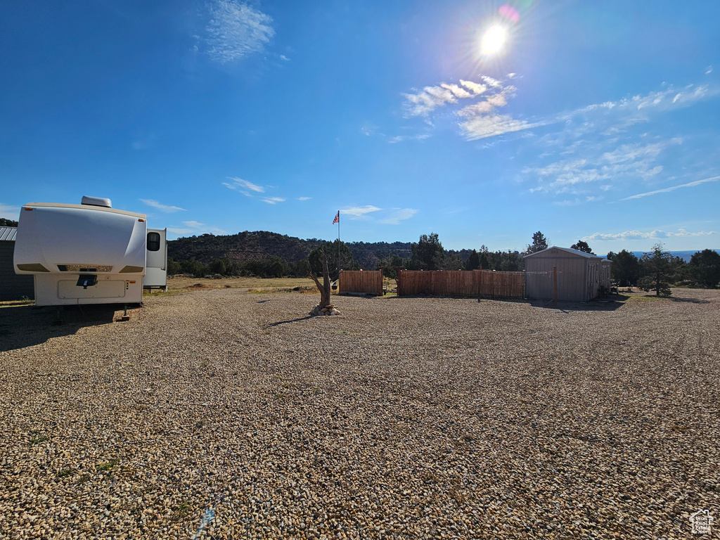 View of yard featuring a shed