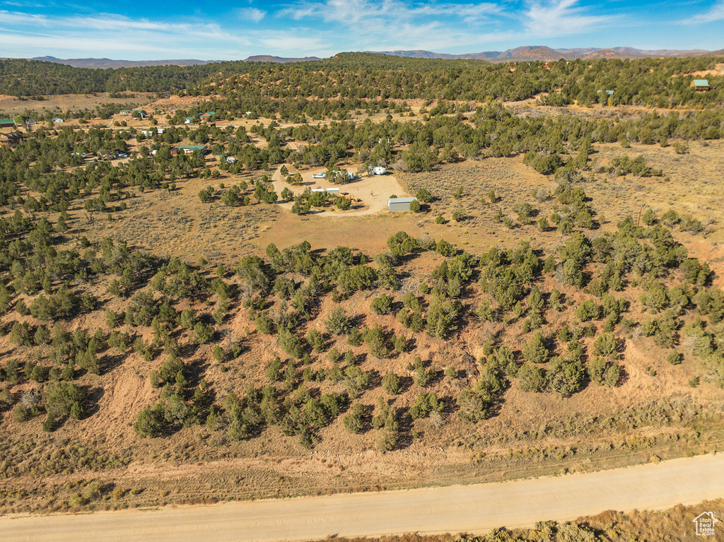 Birds eye view of property with a mountain view