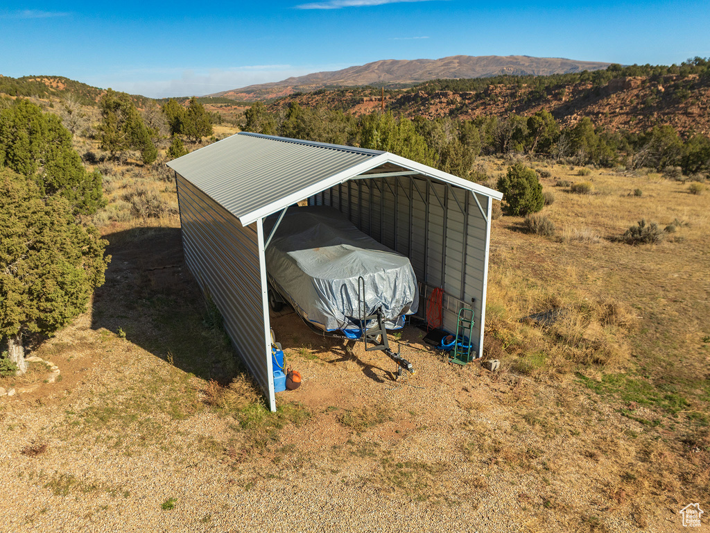 View of outbuilding featuring a carport and a mountain view