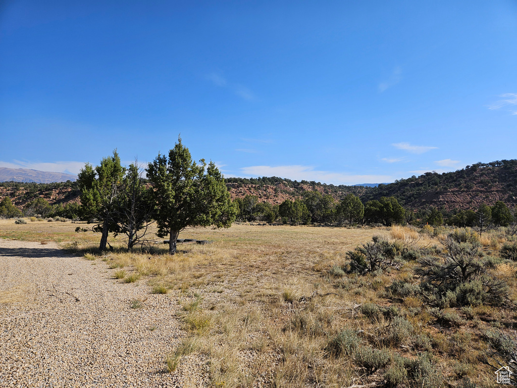 Property view of mountains with a rural view