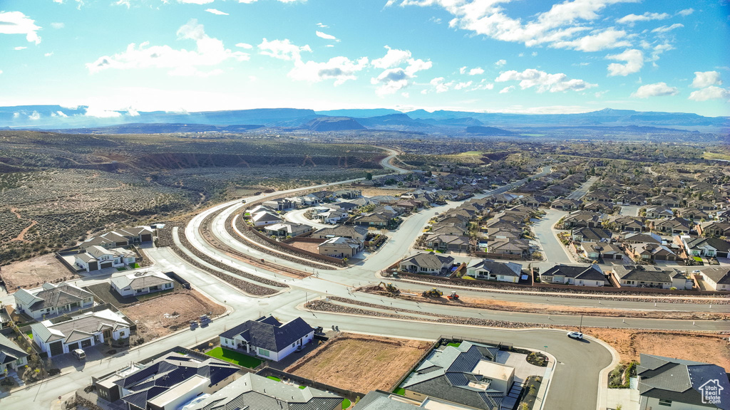 Birds eye view of property with a mountain view