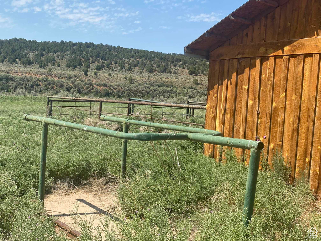 View of gate with a rural view