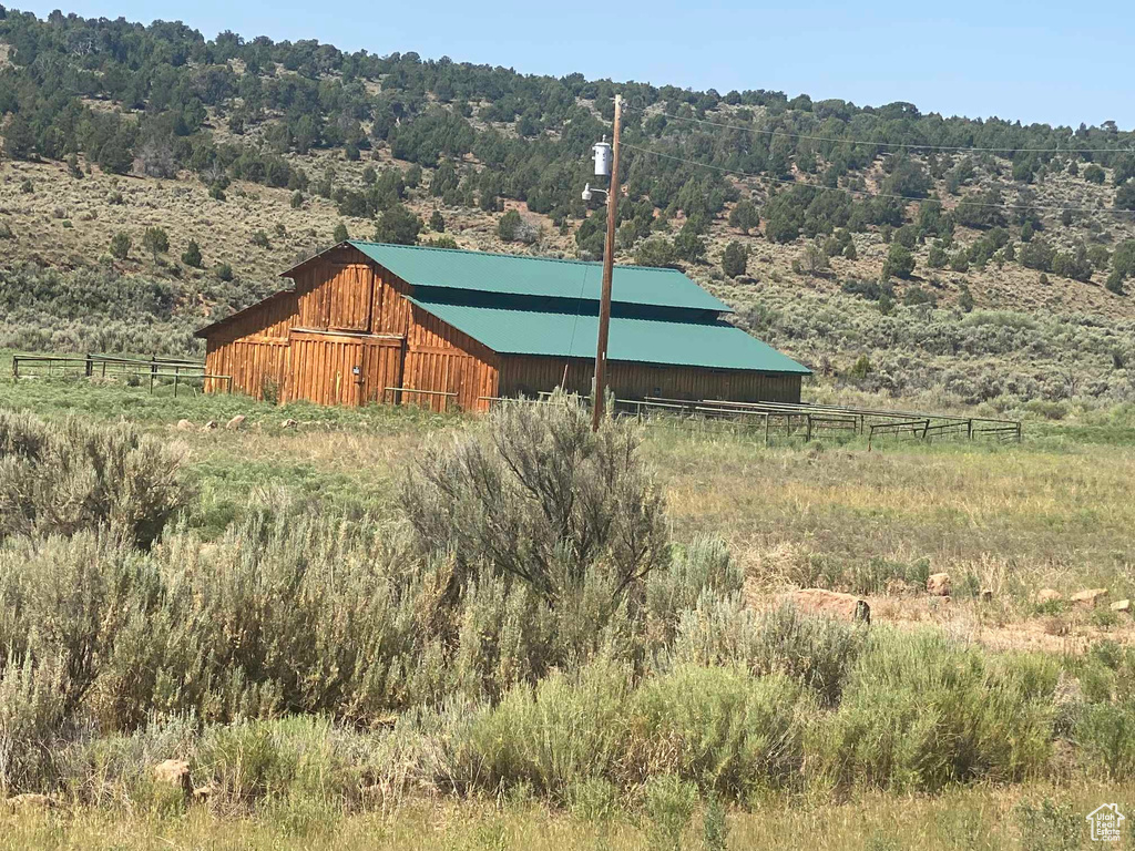 View of outdoor structure with a rural view