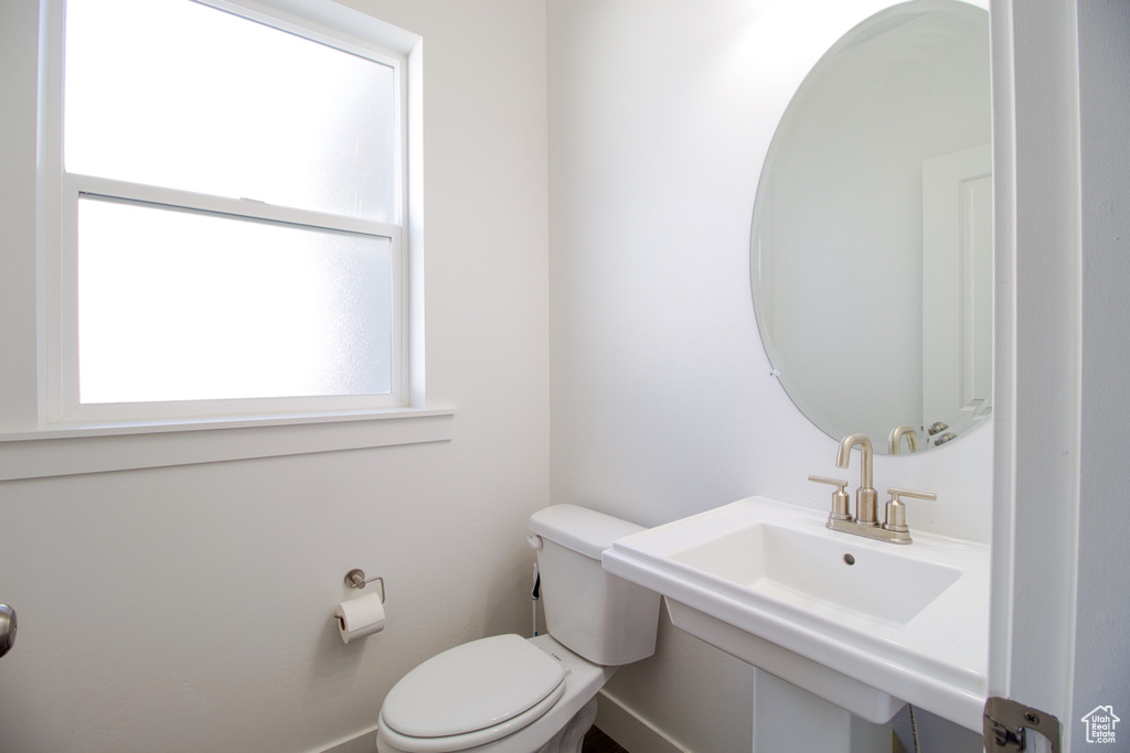 Bathroom featuring sink and toilet