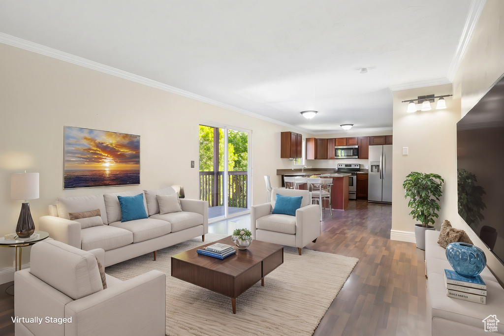 Living room with ornamental molding and dark hardwood / wood-style flooring