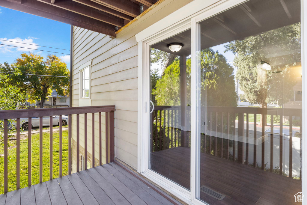 Wooden deck featuring a yard