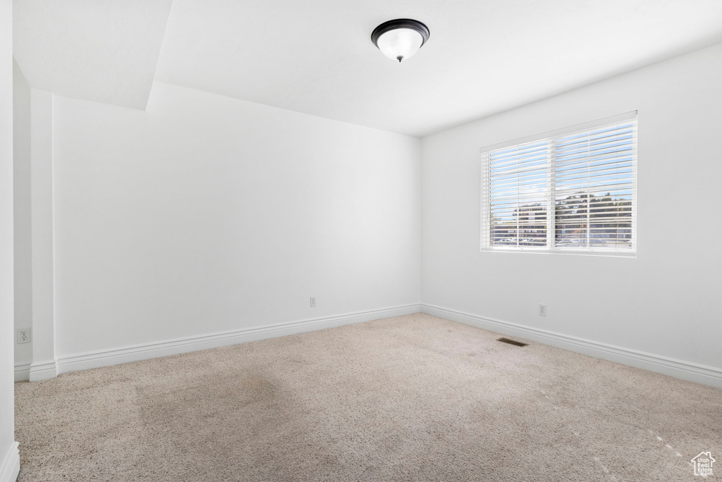 Empty room featuring carpet