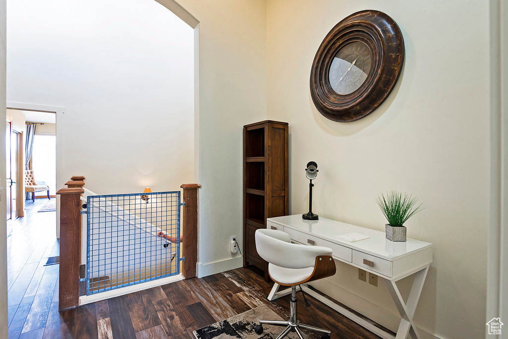 Office space with dark wood-type flooring