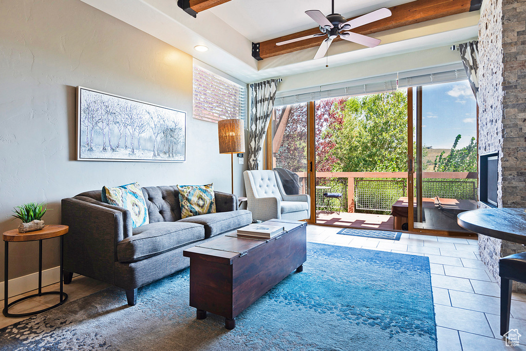 Tiled living room featuring ceiling fan