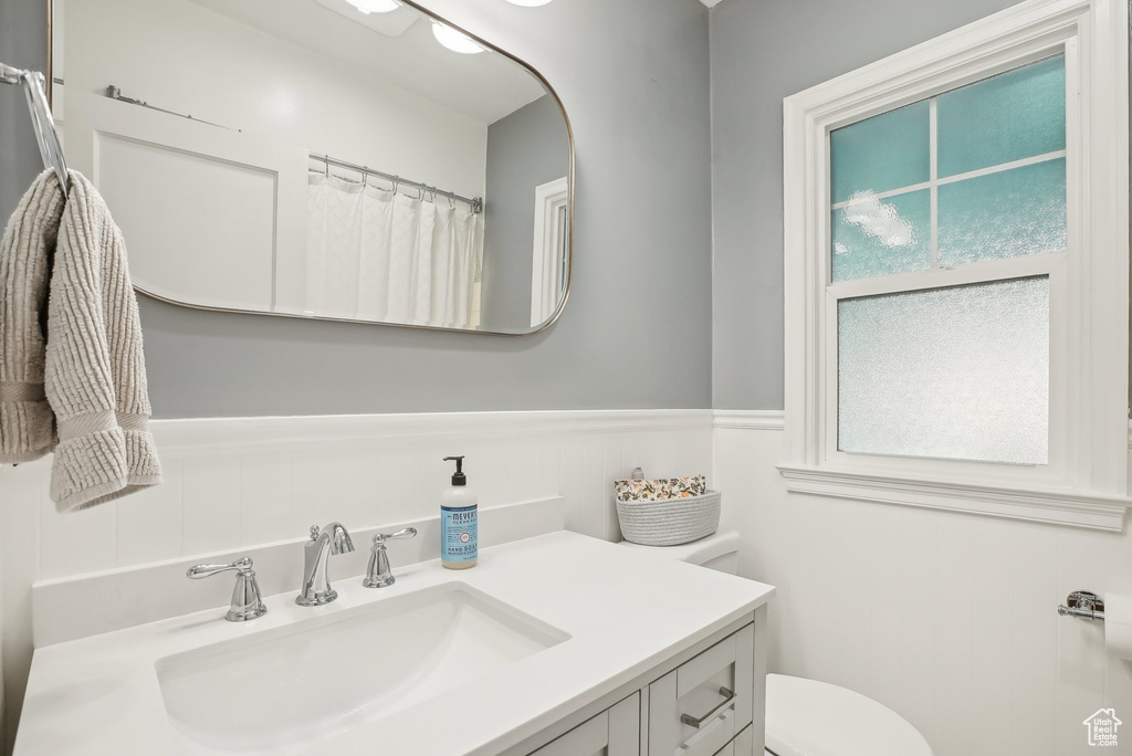 Bathroom featuring vanity and toilet