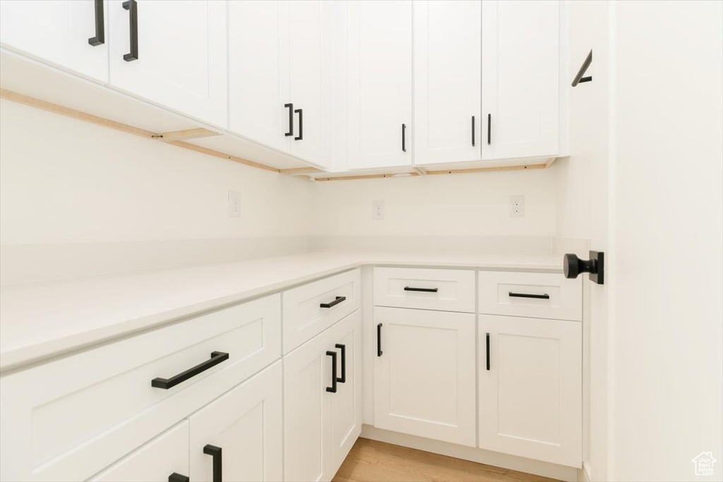 Washroom with light wood-type flooring