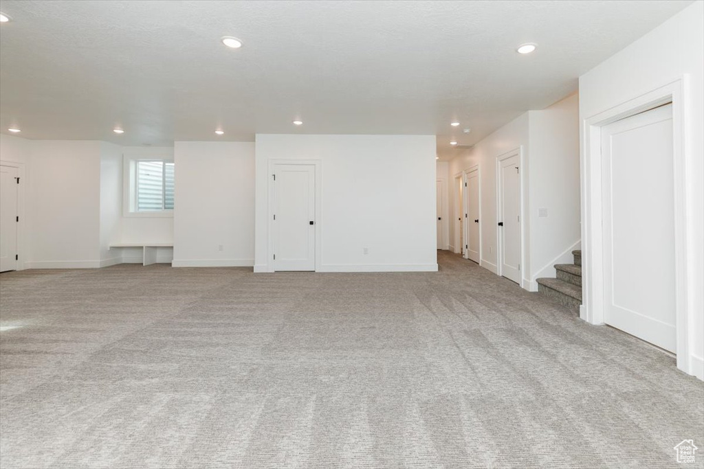 Unfurnished room featuring light colored carpet