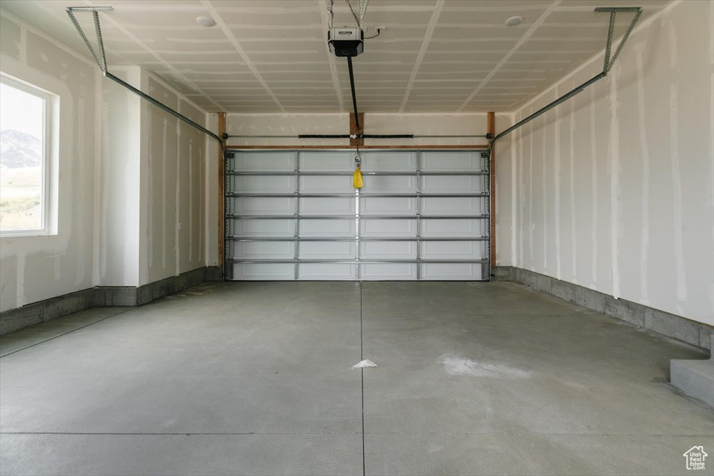 Garage featuring a garage door opener