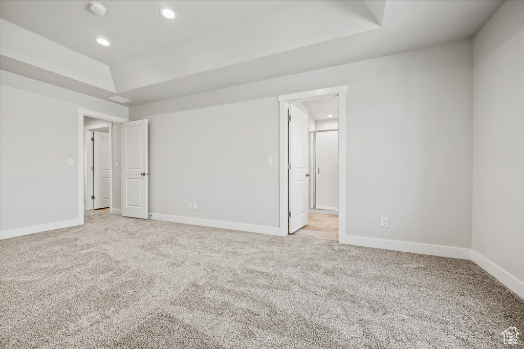 Unfurnished room with light colored carpet