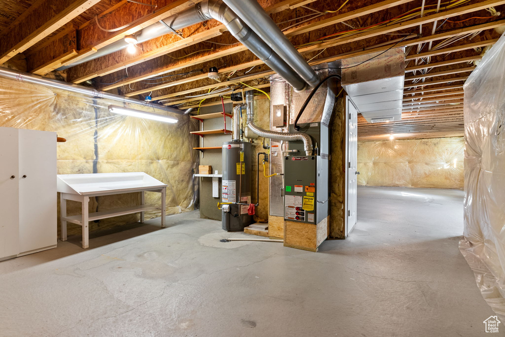 Basement with gas water heater and heating unit