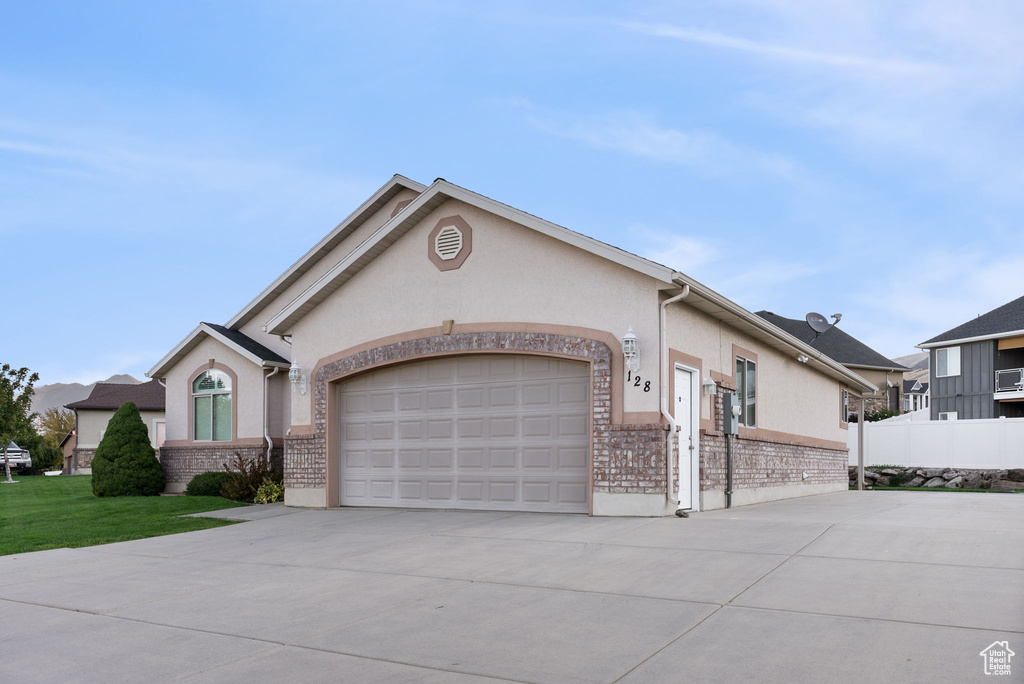 Ranch-style home featuring a garage