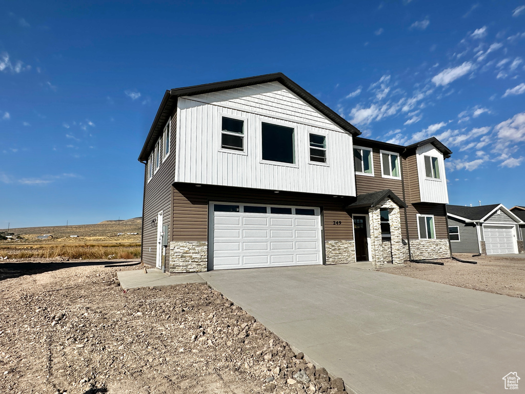 View of front of property featuring a garage