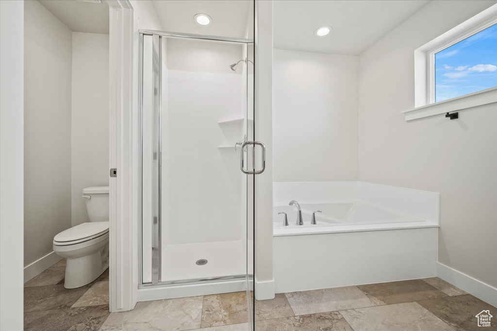 Bathroom with separate shower and tub and toilet