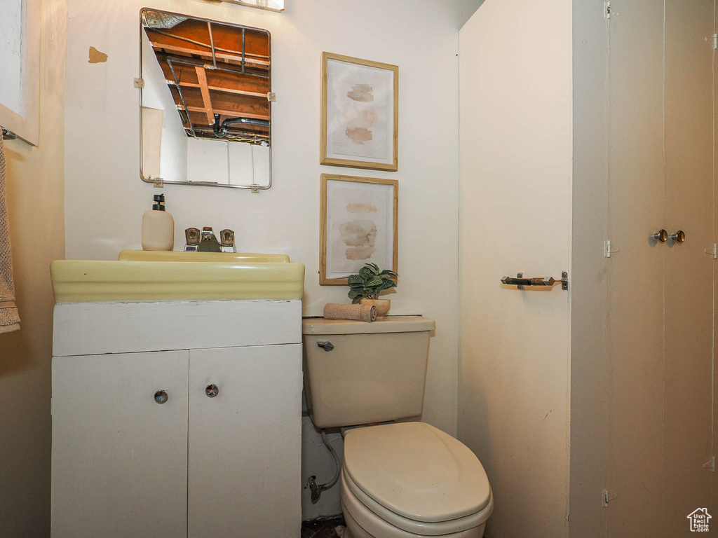 Bathroom featuring vanity and toilet