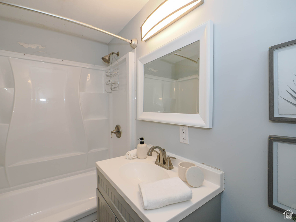 Bathroom featuring bathtub / shower combination and vanity