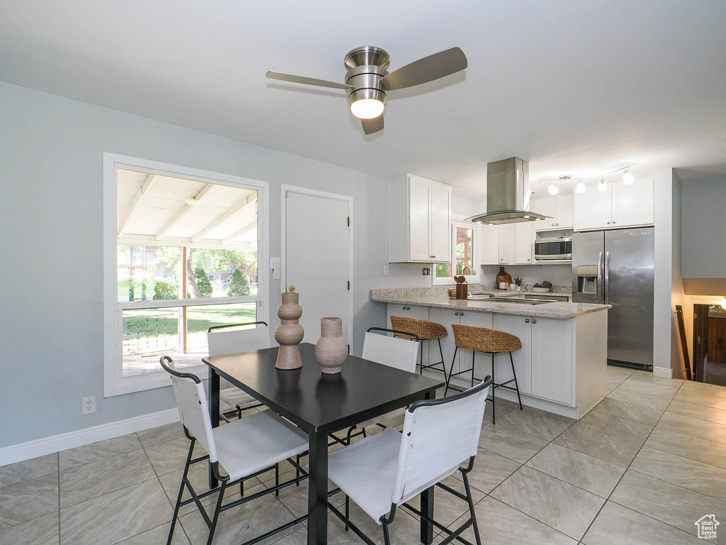 Dining area with ceiling fan