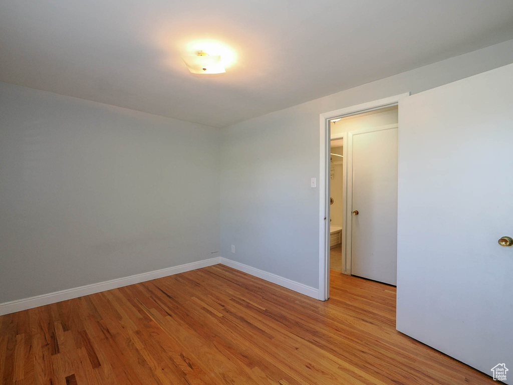 Unfurnished room with light hardwood / wood-style flooring