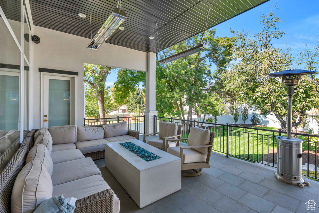 View of patio / terrace with an outdoor living space with a fire pit