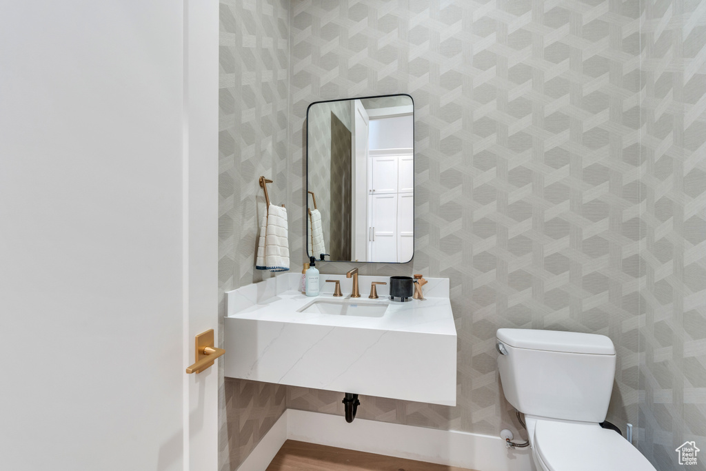 Bathroom with sink and toilet