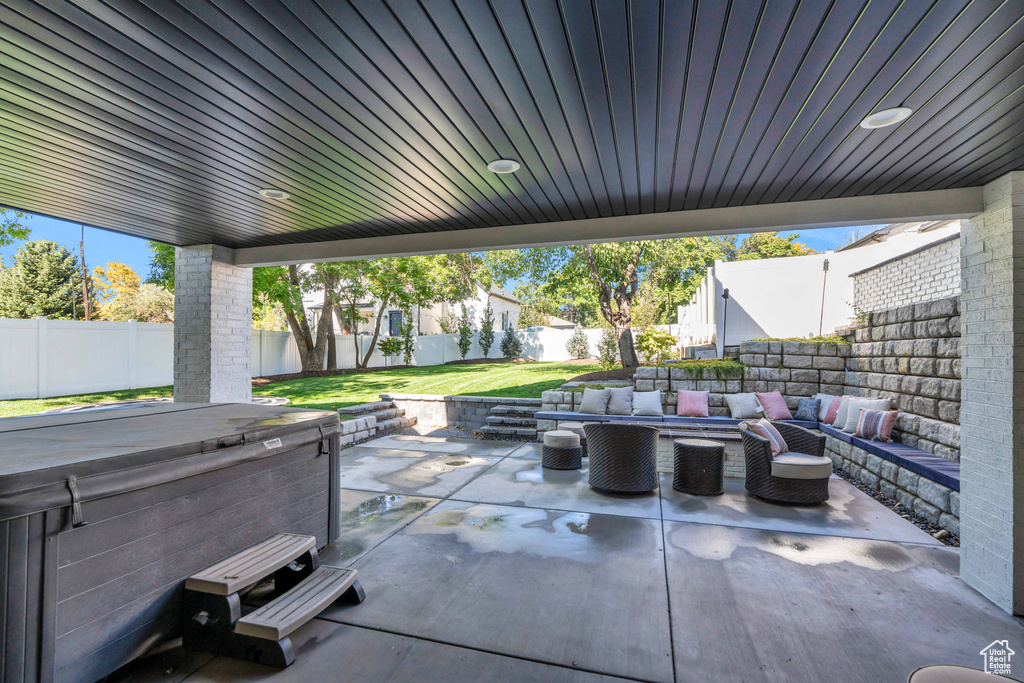 View of patio / terrace with outdoor lounge area and a hot tub