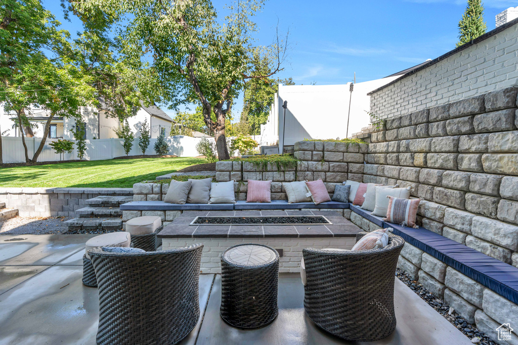 View of patio / terrace with an outdoor living space with a fire pit