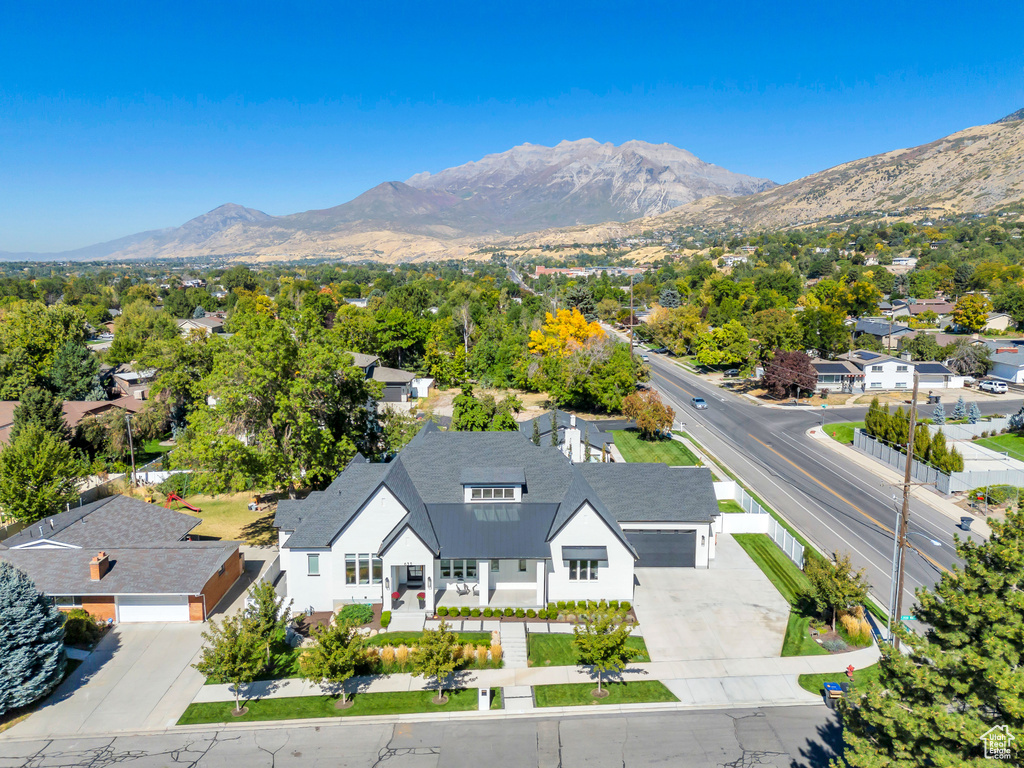 Birds eye view of property with a mountain view