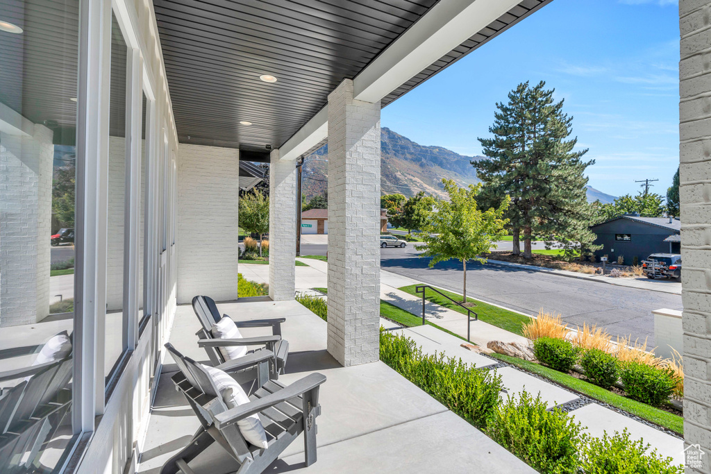 View of patio / terrace featuring a mountain view and covered porch