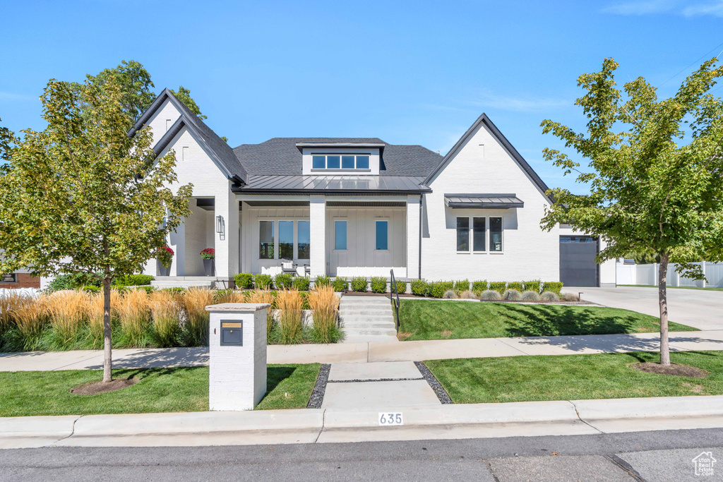 View of front of house with a front yard