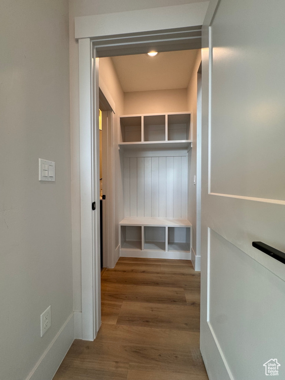 Mudroom with wood-type flooring