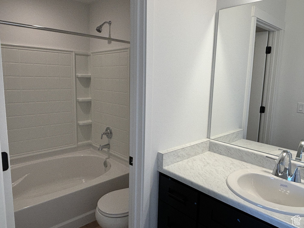 Full bathroom with vanity, toilet, and shower / washtub combination