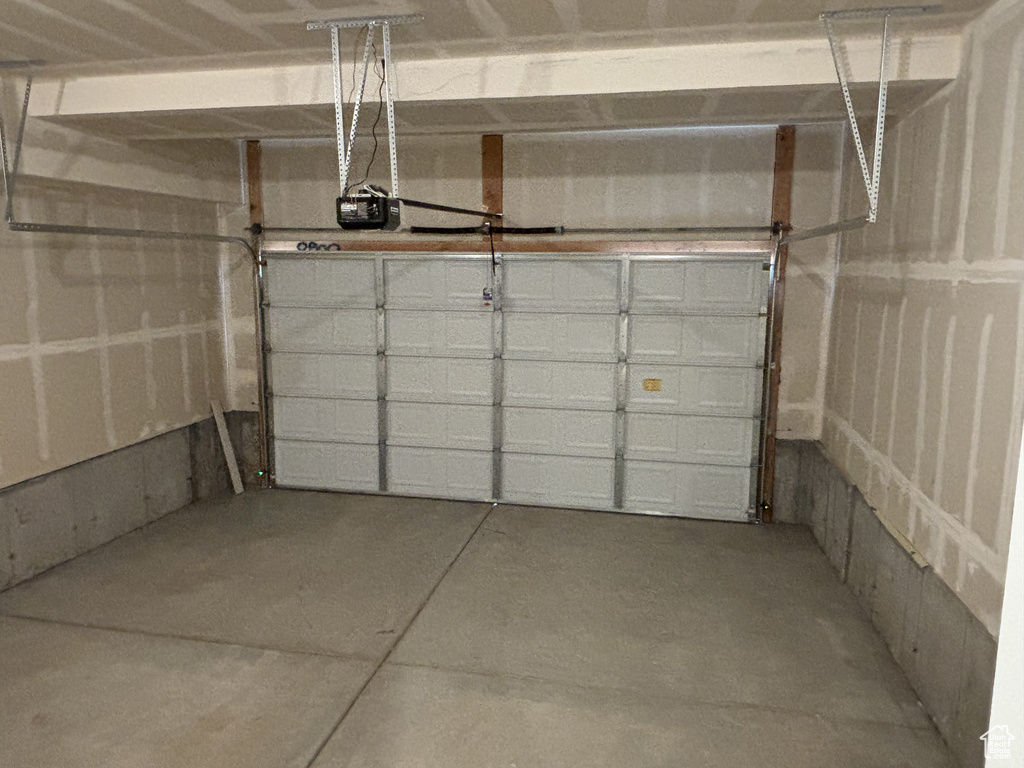 Garage featuring a garage door opener