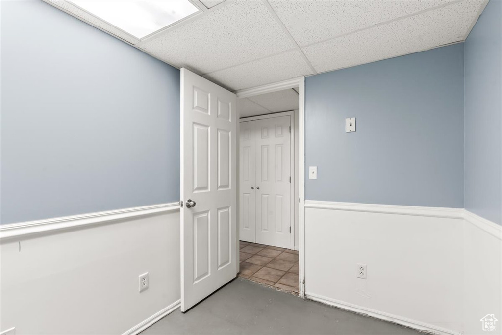 Interior space with concrete floors and a drop ceiling