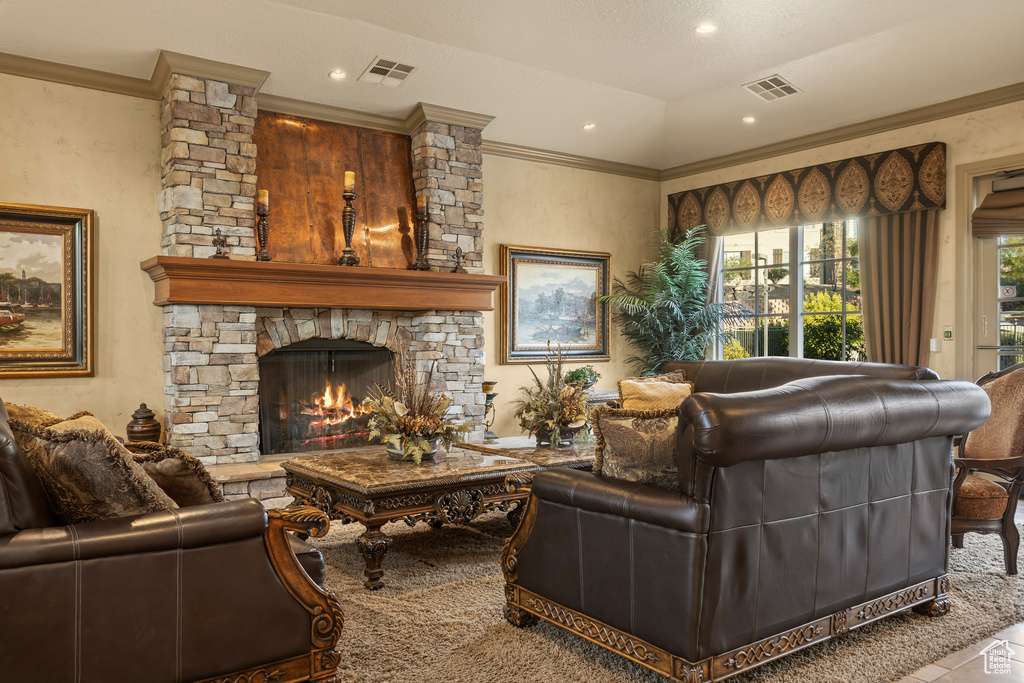 Living room with a fireplace and crown molding